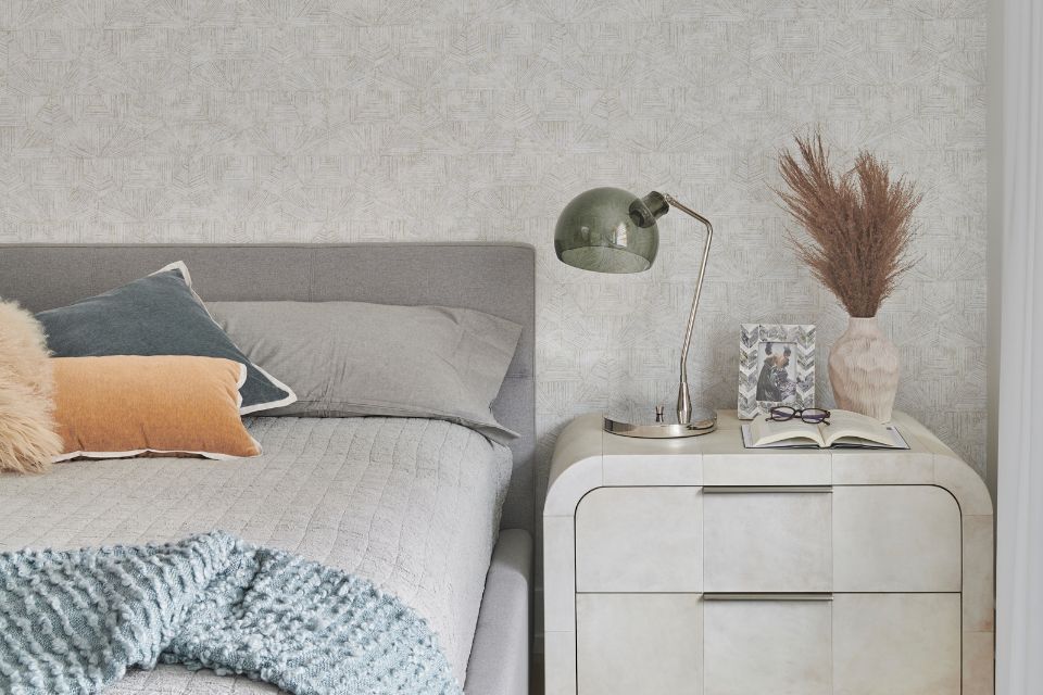 cozy bedroom with textured walls and earth tones
